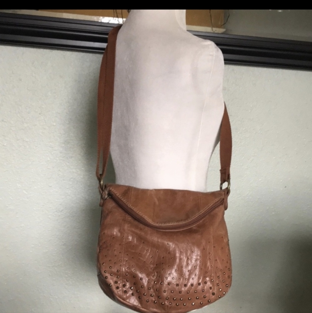 The Sak brown leather studded cross body bag